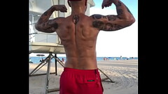 FLEXING BACK AT BEACH Thumb